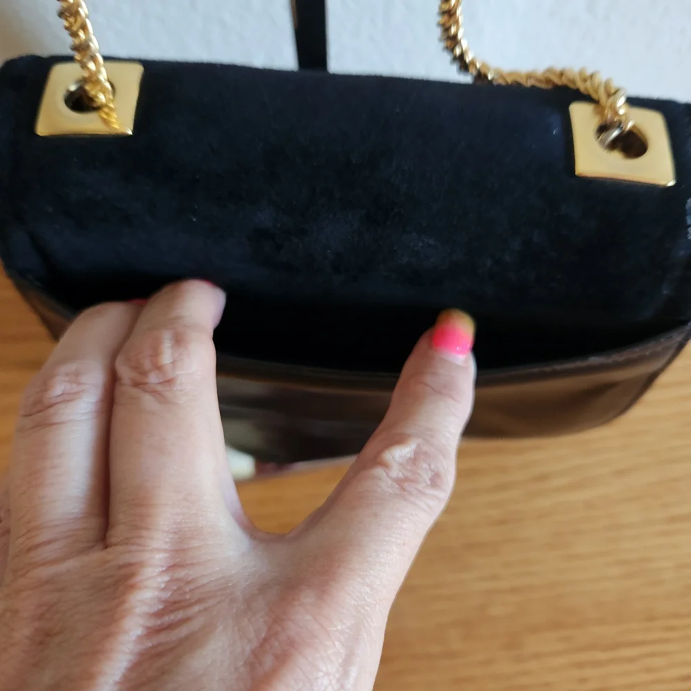 Elegant Black Shoulder Bag with Gold Accents